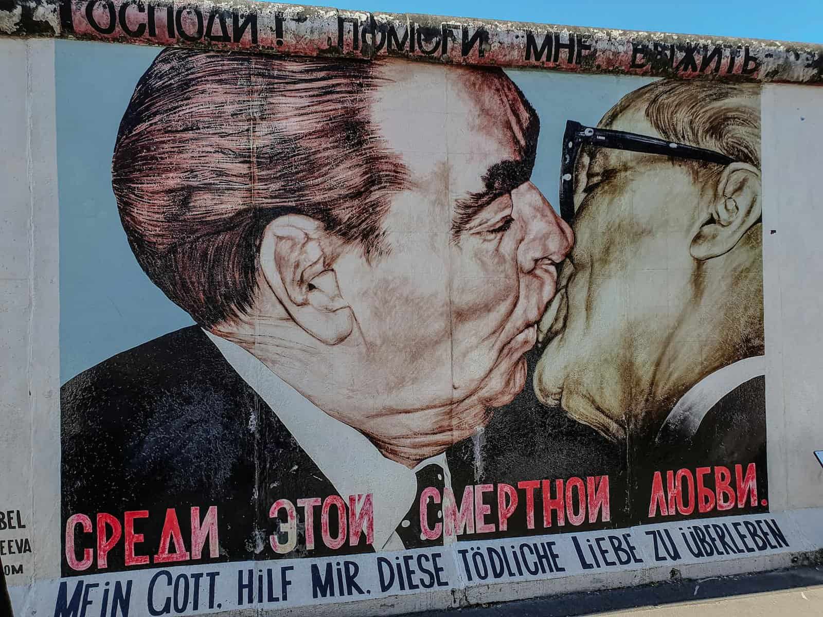 iconic berlin wall mural depicting famous kiss